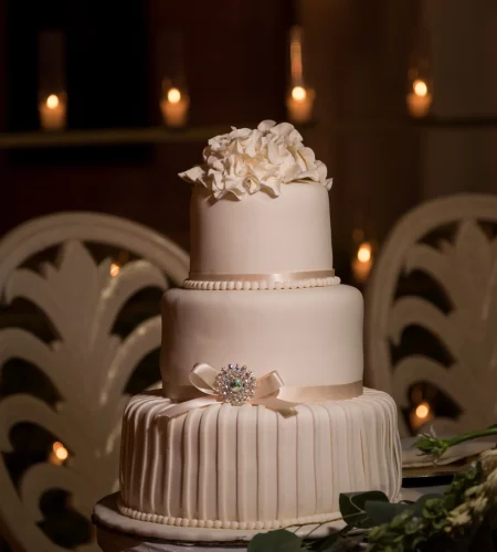 three-tiered-white-fondant-wedding-cake-topped-with-buttercream-flowers